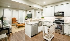 Kitchen and living space with wood floors, stainless steel appliances, and smooth countertops.