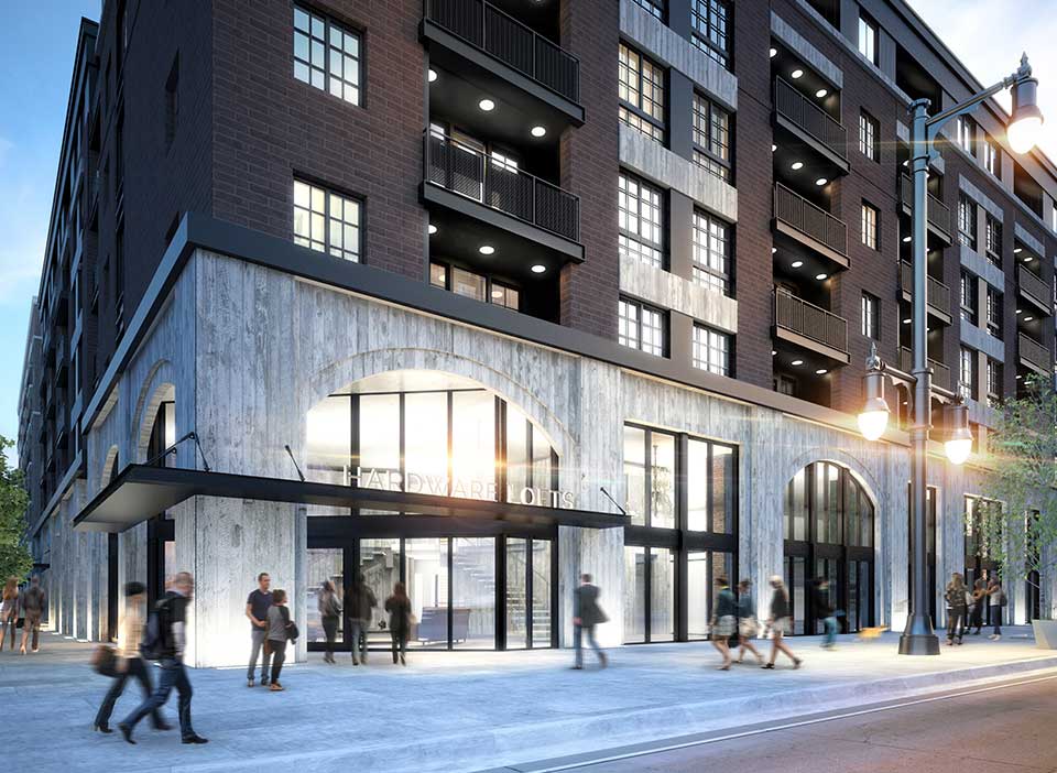 Rendering of Hardware District entrance with concrete and brick facade and tall metal street lamps.